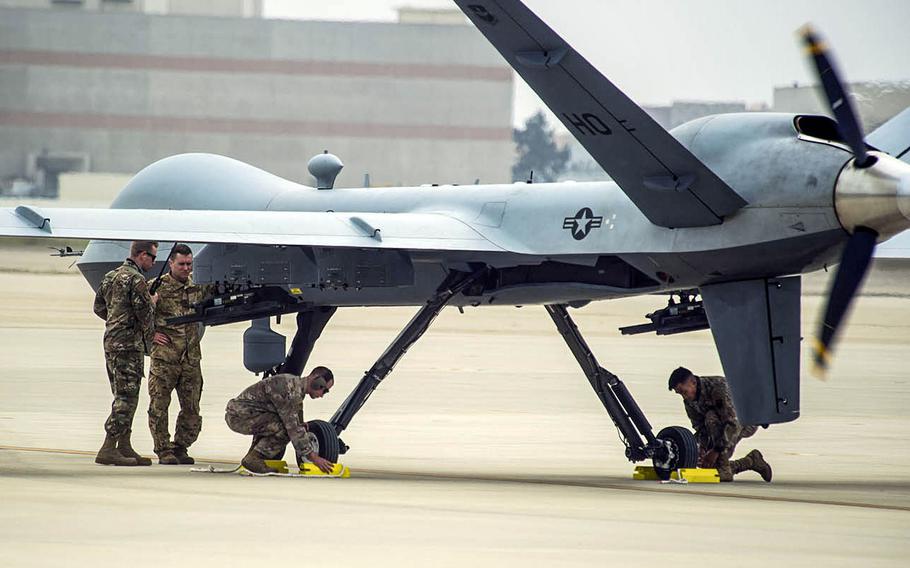 Maintainers from the 9th Aircraft Maintenance Unit and an operator from the 29th Attack Squadron work to recover a MQ-9 Reaper during Exercise Agile Reaper at Naval Air Station Point Mugu, Calif., Sept. 12, 2020.