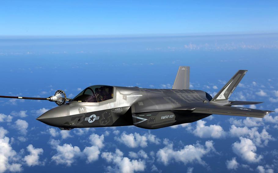 An F-35B joint strike fighter jet attaches to the hose of a KC-130J during aerial refueling training over the Atlantic Ocean, Aug. 13, 2015.