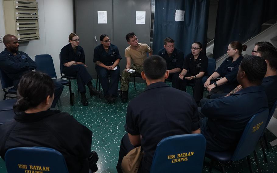 Members of the amphibious assault ship USS Bataan's Suicide Prevention Team conduct a team meeting in the ship's chapel on July 18, 2019. 