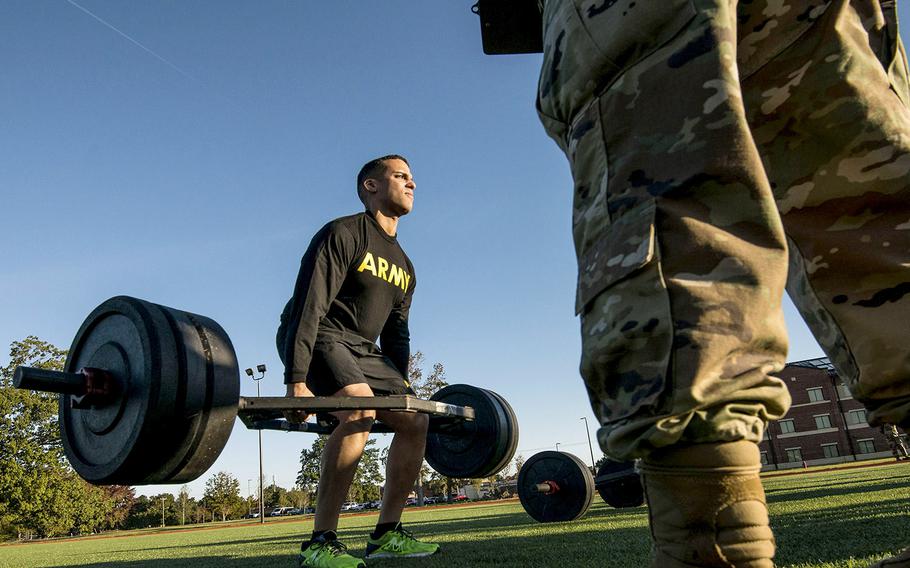 In an October, 2018 photo, a soldier with the 128th Aviation Brigade at Fort Eustis, Va., attempts the deadlift during a demonstration of the Army’s new Army Combat Fitness Test.