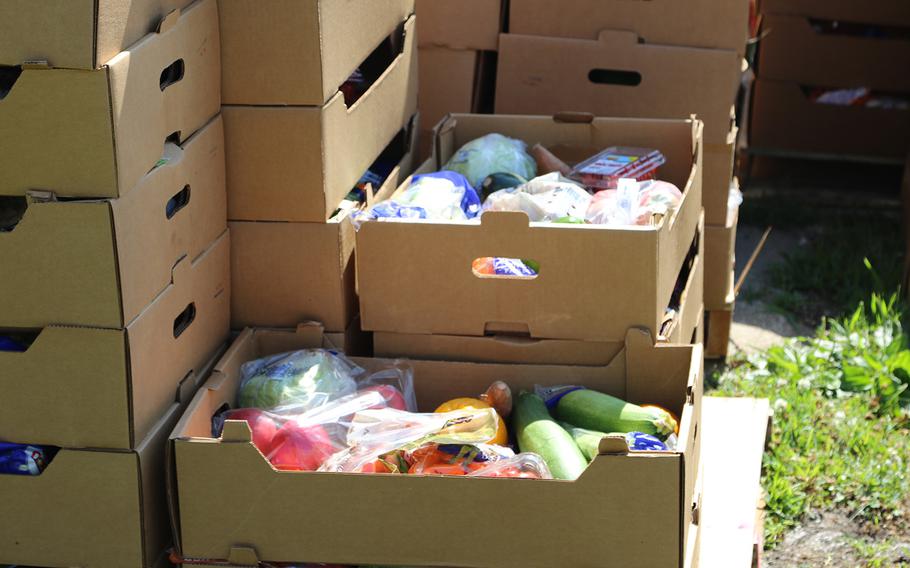 Kansas National Guardsmen and volunteers hand out boxes of fresh produce and dry goods at a food pantry in Effingham, Kan., on June 22, 2020.