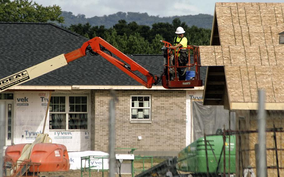 In an August, 2016 photo, contractors work on new housing units at Fort McCoy, Wis. The Army plans to invest $2.8 billion into base housing over the next five years, including 3,800 new homes and renovations for nearly 18,000 homes.