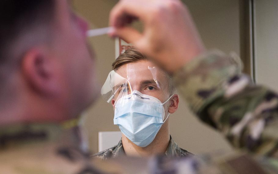 In a June 4, 2020 photo, A U.S. Air Force airman from the 133rd Medical Group oversees COVID-19 testing in St. Paul, Minn.