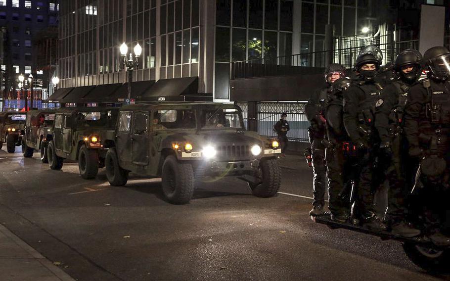 Oregon State Police and the Oregon National Guard patrol the streets in downtown Portland on Wednesday, Nov. 4, 2020.