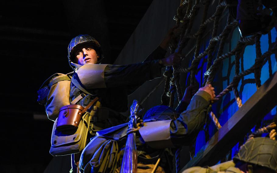 The National Museum of the United States Army includes some 70 cast figures of soldiers in action, including this one of a soldier lowering himself into a Higgins Boat used in the Normandy Beach landings during World War II. The casts were created from scans of current active-duty soldiers. 
