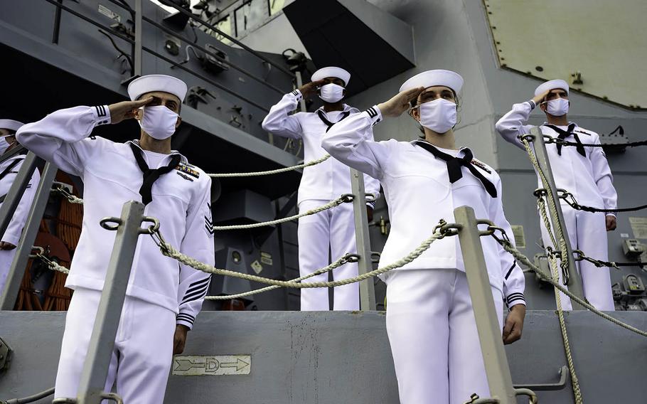 Sailors aboard the guided-missile destroyer USS Michael Murphy salute the Battleship Missouri Memorial and USS Arizona Memorial in Pearl Harbor, Hawaii, Sept. 2, 2020. 