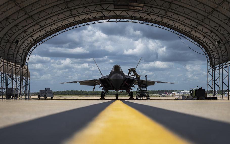 Airmen from the 325th Maintenance Squadron perform maintenance on an F-22 Raptor at Eglin Air Force Base, Florida, July 18, 2019. The F-22 fleet failed to meet target goals for mission capability readiness from 2011 to 2019, a Government Accountability Office report in November 2020 said.