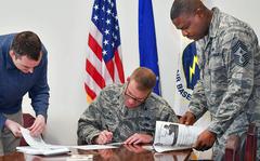 Service members complete their Combined Federal Campaign pledge forms at Hanscom Air Force Base, Mass., Oct. 17, 2020. 