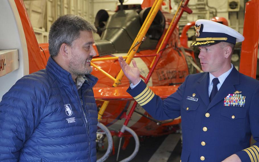 Capt. Thomas Crane, commanding officer of the cutter USCGC Campbell, talks with Greenland Prime Minister Kim Kielsen aboard the ship in Nuuk, Greenland, Sept. 15, 2020.

