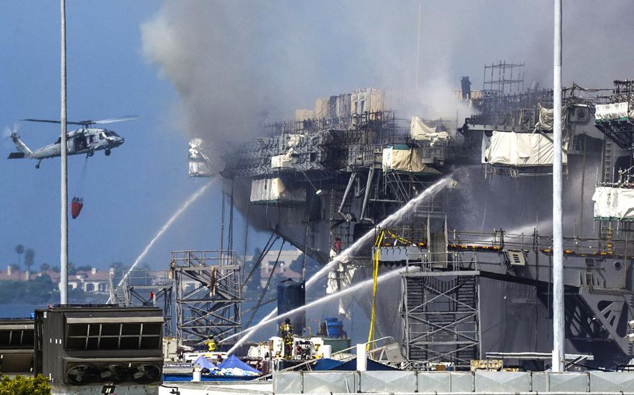Firefighters battle the blaze aboard USS Bonhomme Richard at San Diego Naval Base on July 13, 2020.