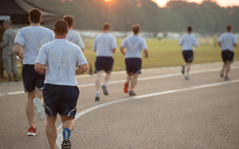 Officer Training School trainees run during an Air Force physical training test at Maxwell Air Force Base, Ala., Aug. 8, 2019. At least three Air Force bases in the U.S. have postponed the resumption of fitness testing until April amid the worsening pandemic. 

