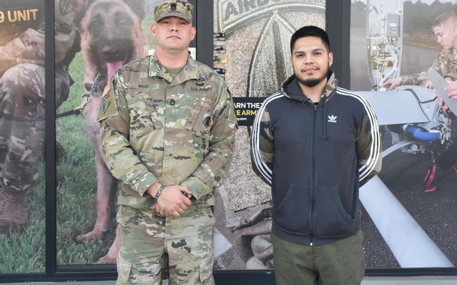 Future soldier Kenny Oliver, right, poses with his recruiter Sgt. 1st Class Daniel Moe outside Arrowhead Recruiting Station in Glendale, Ariz., on Dec. 3, 2020. Oliver, who helped write and produce the 2011 hit "Sexy and I Know It," enlisted in the U.S. Army in late 2020 and will ship out to basic combat training on Dec. 28.
 
