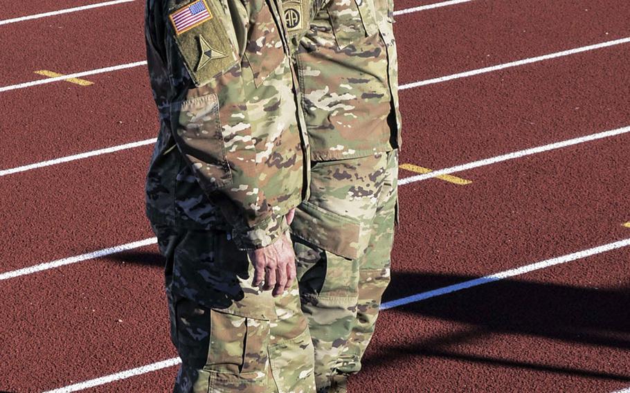 Lt. Gen. Pat White and Command Sgt. Maj. Cliff Burgoyne Jr., commander and senior noncommissioned officer of III Corps and Fort Hood, listen to soldiers Tuesday at an outdoor stadium at Fort Hood, Texas. White addressed an Army report released that morning that shed light on the failings of base leadership and resulted in disciplinary action for 14 leaders.