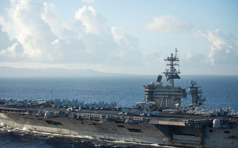 The aircraft carrier USS Theodore Roosevelt approaches Apra Harbor, Guam, June 3, 2020. 