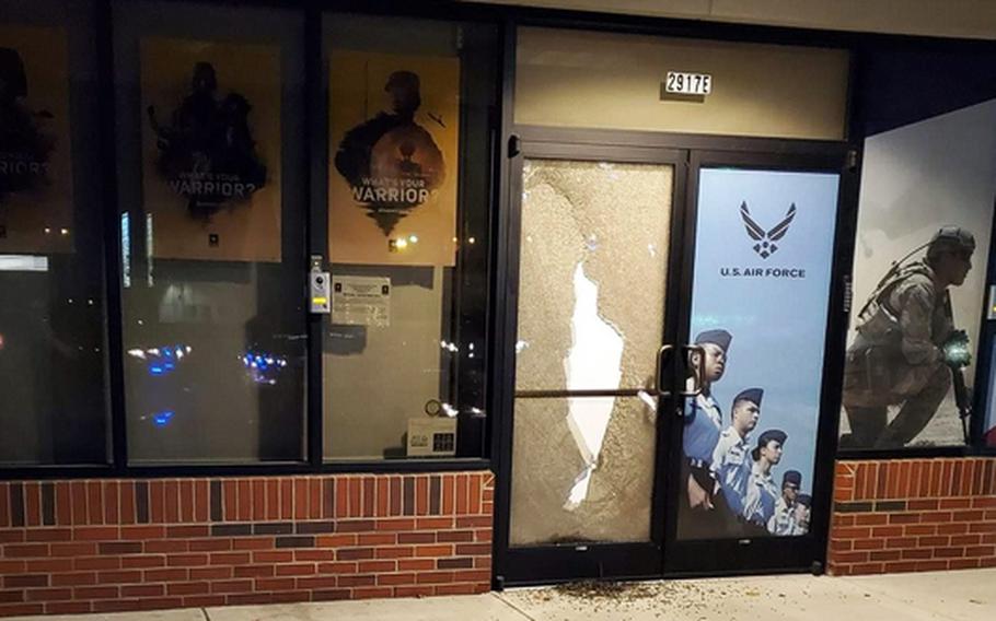 A photo posted on the unofficial Army Recruiter Times Facebook page show damage to the Armed Forces Recruiting Center in Greensboro, N.C., from a shooting Monday night. Police charged James Alexander Cooper, 36, with opening fire on the center. Military officials said he had been denied enlistment in the Army before the incident.