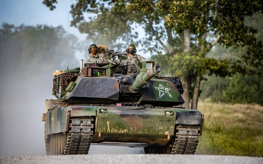 An M1 Abramstank, crewed by students of the Armor Basic Officer Leader Course, negotiates the terrain while training at Good Hope Maneuver Training Area, Fort Benning, Ga., Sept. 22, 2020. General Dynamics Land Systems has been awarded a $4.6 billion contract to produce a modernized version of the tank.   

