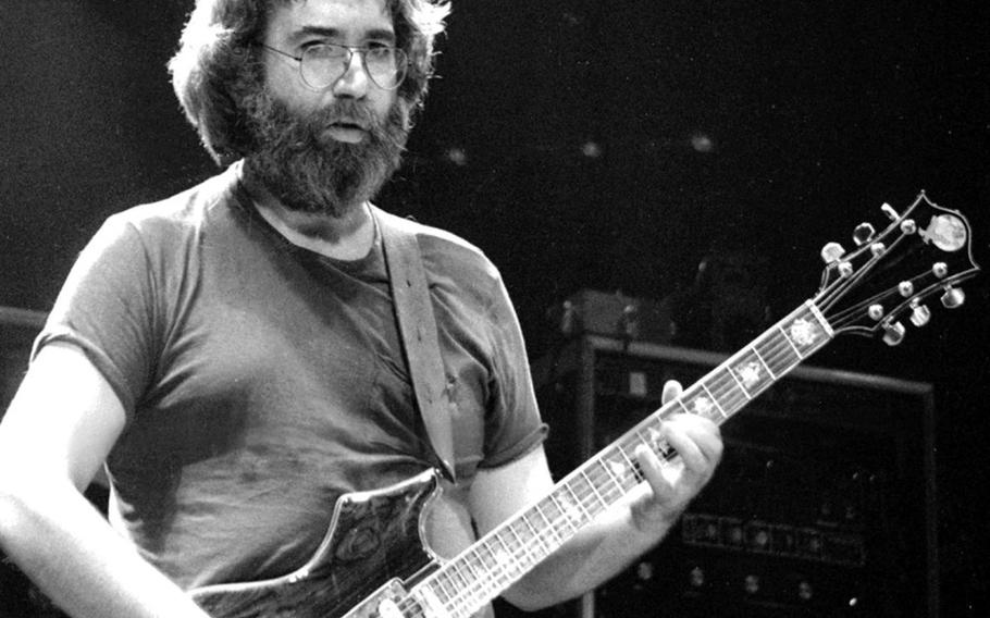 Jerry Garcia plays during the Grateful Dead's European tour stop at the Walter Koebel Halle, in Ruesselsheim, Germany, Oct. 1981. Garcia joined the Army in April 1960, but received a general discharge just nine months later.
