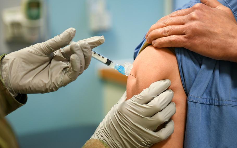 An Airman assigned to the 48th Fighter Wing Medical Group receives the COVID-19 vaccine at RAF Lakenheath, England, Dec.29, 2020.  The U.S. military’s campaign to vaccinate personnel in Europe against the coronavirus gathered steam this week as health care workers on the front lines of fighting COVID-19 were inoculated at bases in Germany and the United Kingdom.
