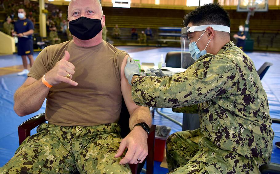 U.S. Pacific Fleet Fleet Master Chief James Honea receives the coronavirus vaccine at Joint Base Pearl Harbor-Hickam in Hawaii on Dec. 29, 2020, from Hospital Corpsman 2nd Class Philip Sayma, assigned to Navy Environmental and Preventative Unit 6. Naval Health Clinic was one of the facilities selected to receive the vaccine in a phased and coordinated strategy, prioritizing the vaccine for eligible personnel to protect their health, families, and communities.