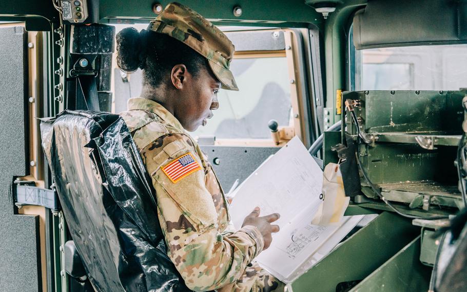 Pfc. Katelyn McCurrie, information technology specialist, Headquarters and Headquarters Battalion, U.S. Army Europe, performs motor pool inspection duties Aug. 10, 2020 at the Clay Kaserne motor pool in Wiesbaden, Germany.