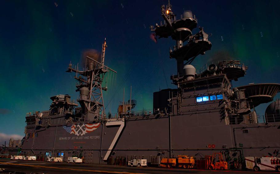 The Wasp-class amphibious assault ship USS Iwo Jima (LHD 7) passes under the Northern Lights while participating in exercise Trident Juncture 2018.  On Tuesday, Jan. 5, 2021, The U.S. Navy released its strategy on how the service plans to become more active in the Arctic as the region opens up to more economic and military competition from Russia and China.