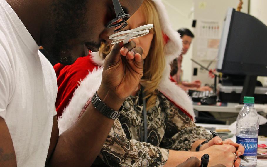 A patient at the Intrepid Spirit on Fort Bragg, N.C., works on a maze using colored glasses during vision rehabilitation, Dec. 15, 2017. The Intrepid Spirit Clinic is focused on traumatic brain injuries and associated conditions, and offers different forms of occupational therapy to patients.