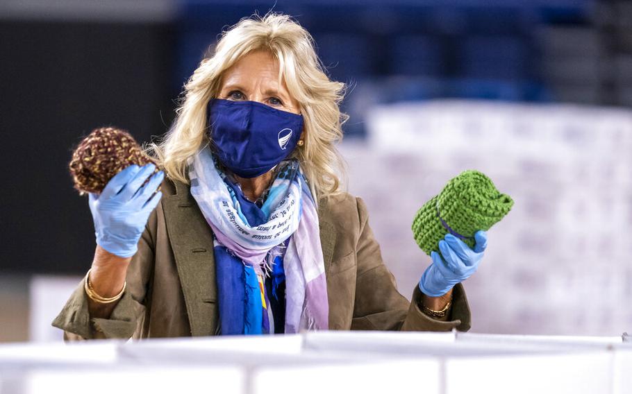 Jill Biden, wife of President-elect Joe Biden, helps to prepare care packages for American troops deployed overseas during the holidays, at the DC Armory in Washington on Dec. 10, 2020.