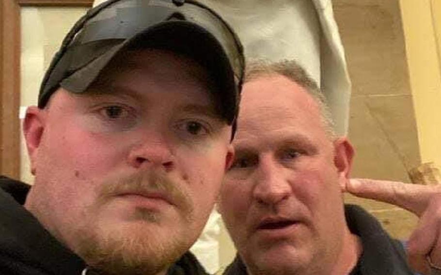 Jacob Fracker, left, a corporal in the Virginia National Guard, was arrested and charged Wednesday with one count of knowingly entering or remaining in any restricted building or grounds without lawful authority and one count of violent entry and disorderly conduct on Capitol grounds.