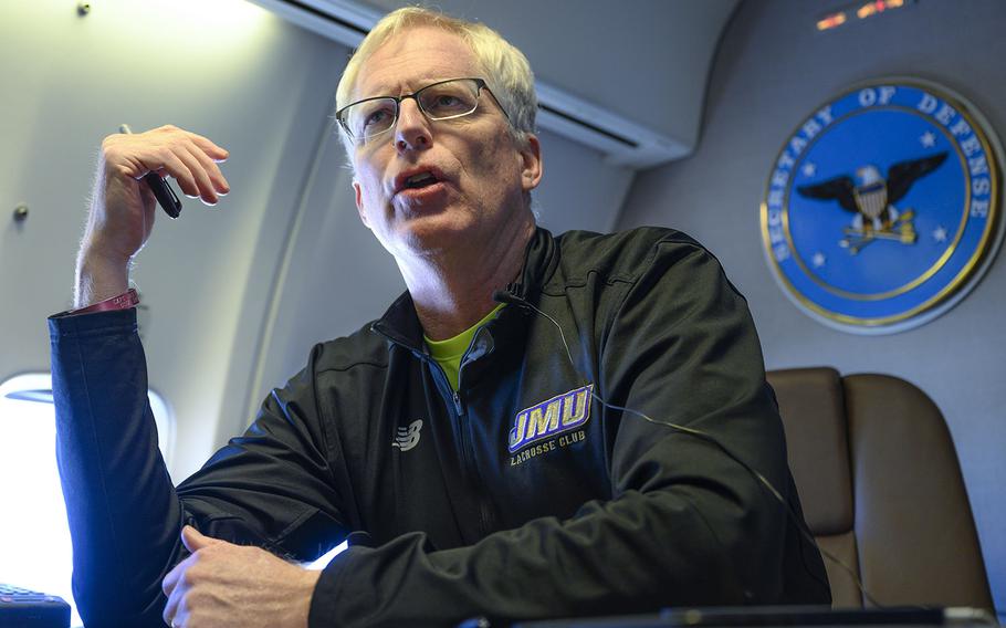 Acting Defense Secretary Chris Miller speaks to reporters on a government aircraft en route to Joint Base Andrews, Md., Jan. 14, 2021.