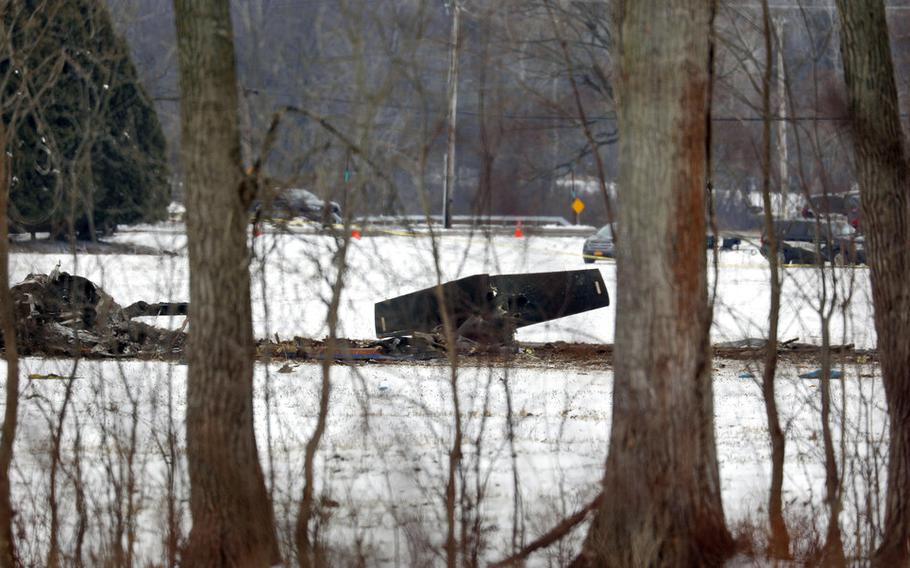 The wreckage of a UH-60 Black Hawk medical evacuation helicopter sits in a field in Mendon, NY., Thursday, Jan. 21, 2021. Three National Guard members were killed in the crash Wednesday evening Jan. 20. 