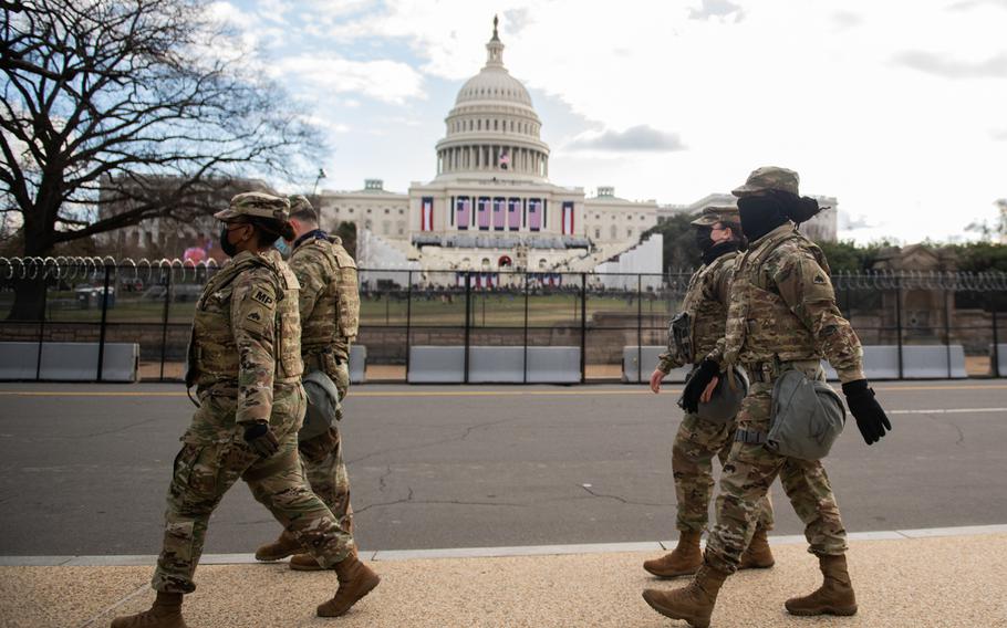 U.S. Soldiers with the District of Columbia National Guard, patrol around the Capitol during the Presidential Inauguration, Washington, D.C., Jan. 20, 2021. 