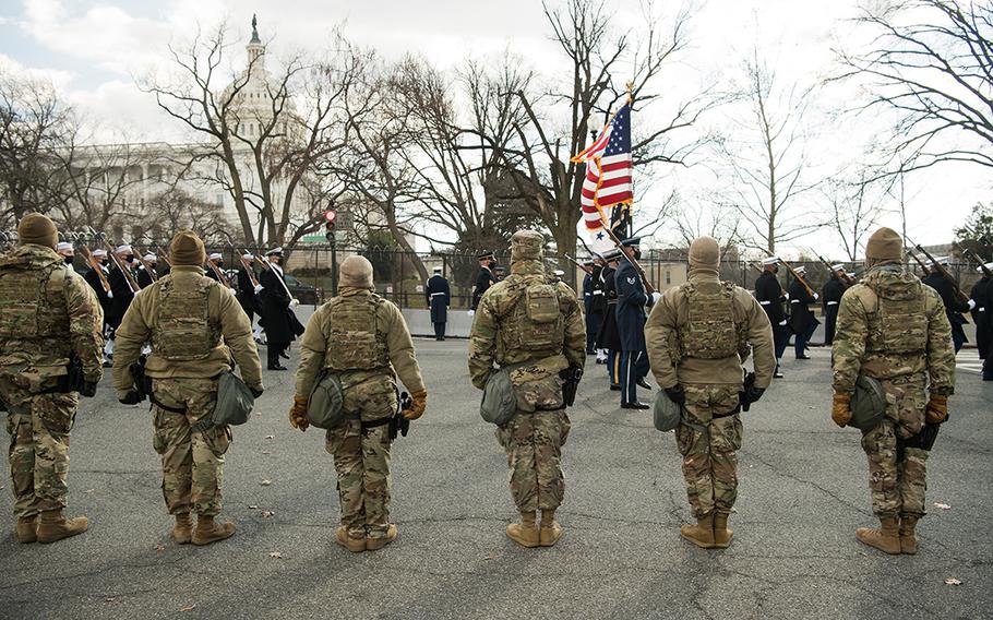 Airmen assigned to the Virginia Air National Guard's 192nd Security Force Squadron, 192nd Mission Support Group, 192nd Wing observe a military parade during the 59th Presidential Inauguration on Jan. 20, 2021, in Washington, D.C.
