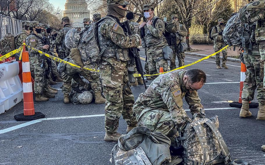 In a Jan. 19, 2021, photo, National Guard troops in Washington, D.C., change shifts.