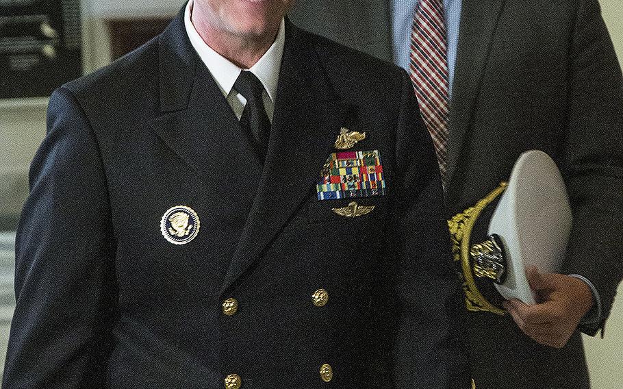 Rear Adm. Ronny Jackson, President Donald Trump's nominee to succeed David Shulkin as Secretary of Veterans Affairs, arrives for a meeting with Senate Veterans' Affairs Committee Chairman Johnny Isakson, R-Ga., on April 17, 2018.