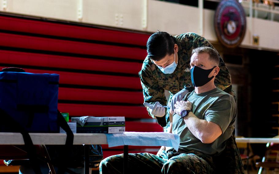 U.S. Marine Corps Col. George Markert, Chief of Staff of 2nd Marine Logistics Group, receives the Pfizer-BioNTech COVID-19 vaccine on Camp Lejeune, North Carolina, January 28, 2021.