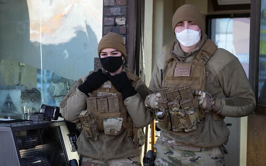 Airmen assigned to the 51st Security Forces Squadron pose for a photo at Osan Air Base, South Korea, Dec. 7, 2020. 