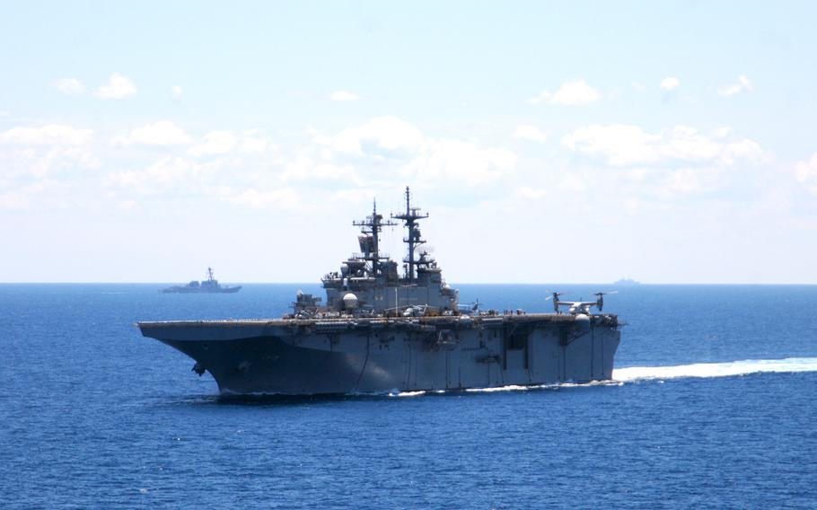 The USS Wasp transits the Atlantic Ocean while participating in the War of 1812 fleet exercise on June 27, 2012. A sailor assigned to the amphibious assault ship died from complications of the coronavirus, the U.S. Navy announced Friday. 