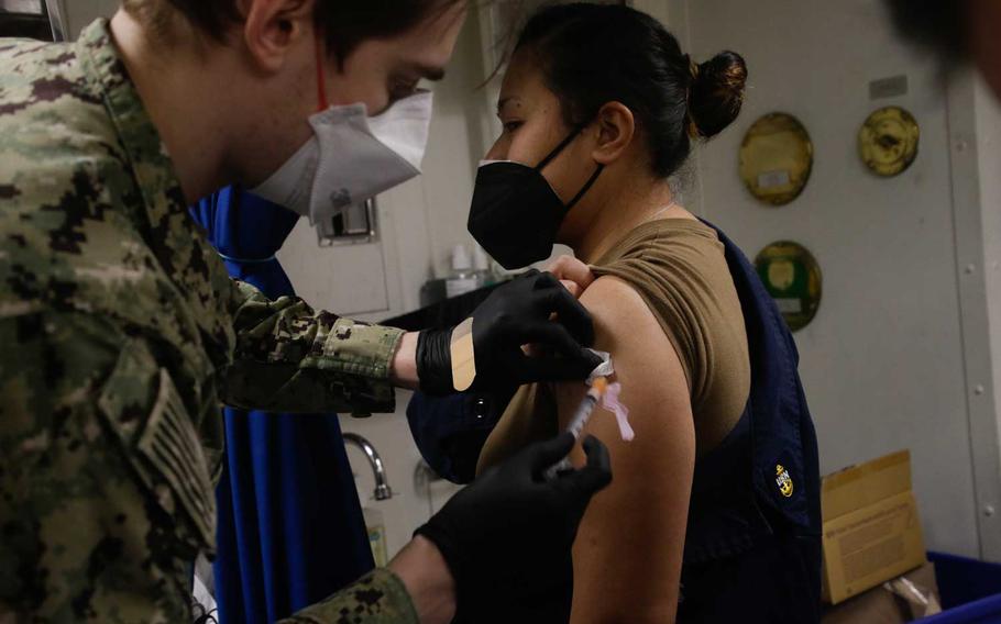 Gas Turbine Systems Technician Chief Petty Officer Sheena Gonzalez receives the COVID-19 vaccine aboard the Arleigh Burke-class guided-missile destroyer USS Mahan on Feb. 13, 2021. 