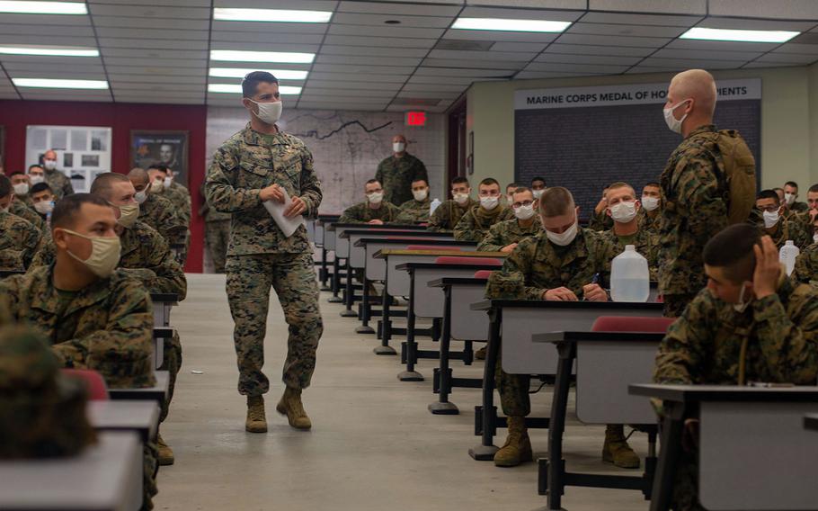 Marine Chief Warrant Officer 3 A.J. Pasciuti, the battalion gunner for Infantry Training Battalion, School of Infantry-West, answers a question from a student about the new infantry course on Marine Corps Base Camp Pendleton, Calif., Jan.25, 2021. 

