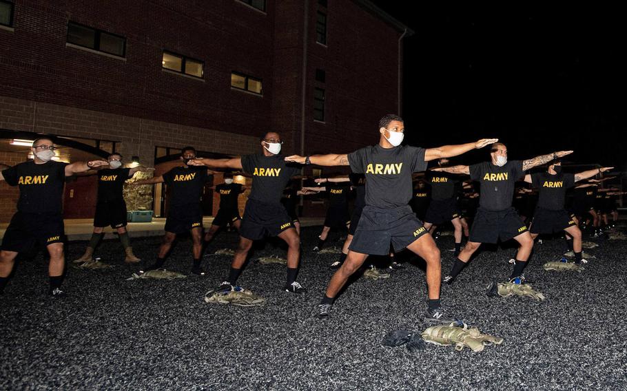 Trainees with 3rd Battalion, 34th Infantry Regiment participate in yoga training on Oct. 29, 2020. The Army is evaluating whether a pilot program incorporating yoga and meditation aided basic training platoons.

