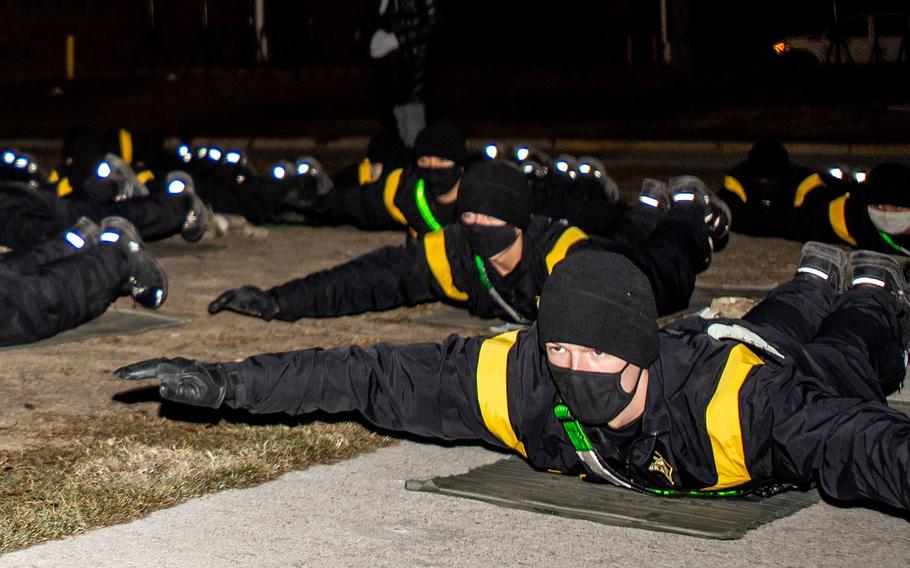 Trainees with 2nd Battalion, 60th Infantry Regiment do yoga as part of a pilot program, Dec. 8. 2020. The Army is evaluating whether a the program, incorporating yoga and mindfulness meditation, affected factors such as physical performance and stress management.

