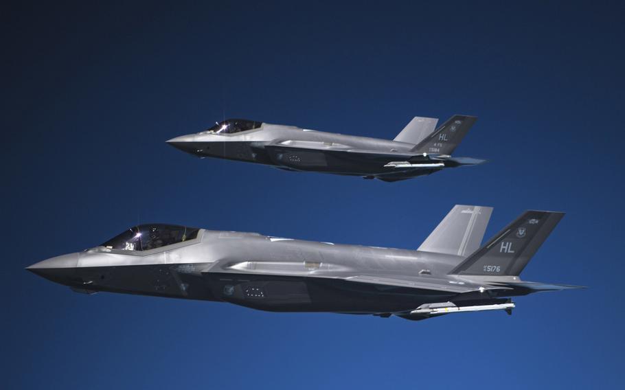 Two F-35A Lightning IIs fly in formation after receiving fuel from a KC-135R Stratotanker in May 2019 over an undisclosed location. The U.S. remained the top spender on defense in 2020, accounting or 40.3 % of global spending, the International Institute for Strategic Studies said Feb. 25, 2021.
