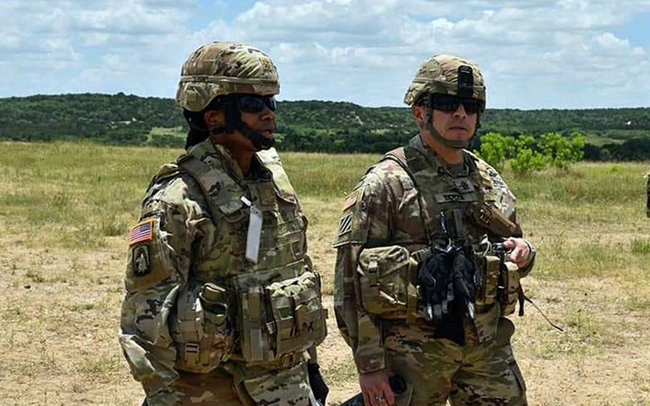 Maj. Jamie Hickman, left, a Fort Hood, Texas-based solider now on a rotational Army mission in Europe, says the military needs to continue making changes to ensure equal opportunity.