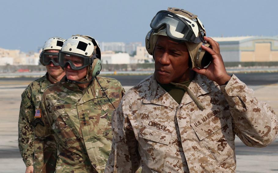 Marine Corps Maj. Gen. Michael E. Langley, right, and U.S. Army Gen. Joseph L. Votel, commander, U.S. Central Command, left, depart to visit the USS Essex Amphibious Ready Group, Oct. 26, 2018. Langley now commands U.S. Marine Forces Europe and Africa.   

