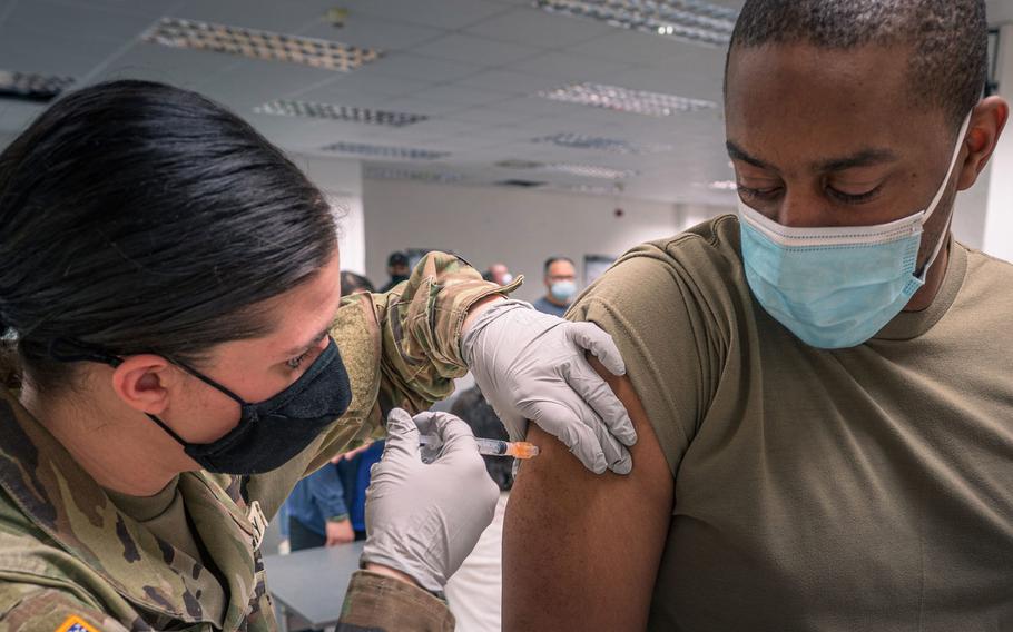 A soldier from the 12th Combat Aviation Brigade receives his second and final coronavirus vaccine dose on Feb. 24, 2021, in Wiesbaden, Germany. 

