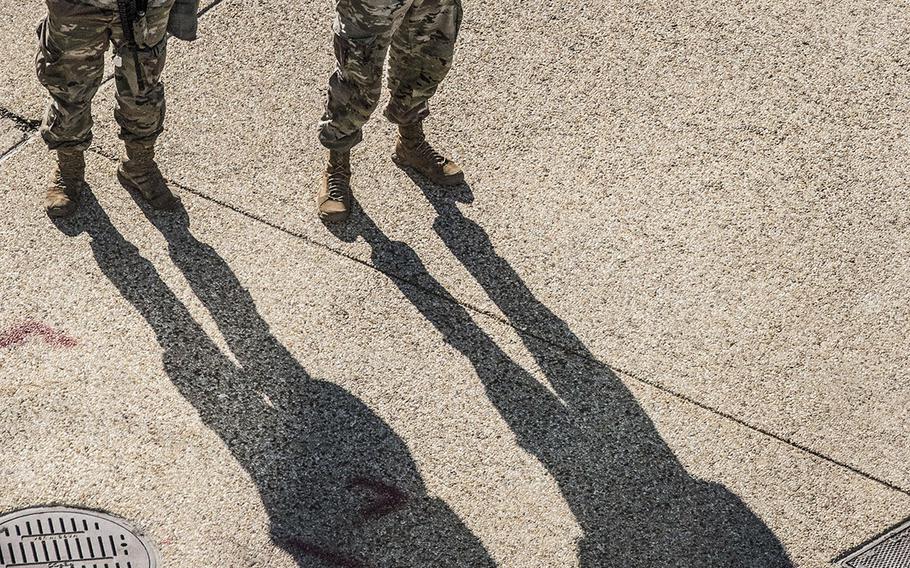 National Guard soldiers stand on Constitution Ave. in Washington, D.C., on March 3, 2021.