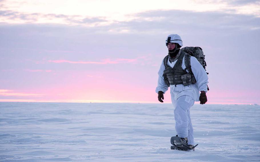 Sgt. Jeremy Hazard snowshoes across the tundra after conducting an airborne operation during exercise Arctic Pegasus in Deadhorse, Alaska, May 1, 2014. The Army needs to reinvigorate how it trains, equips and positions troops in the Arctic region as competition with Russia and China grows, according to the service’s new strategy document released Tuesday.