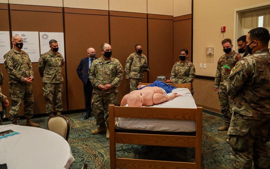 The Sexual Harassment/Assault Response and Prevention program at Fort Bliss, Texas, has created a series of scenarios that encourage small groups of soldiers to have uncomfortable conversations that could inform them on how to prevent sexual assault and harassment among their teammates. In this scenario, a soldier is passed out and naked in the barracks after a night of drinking alcohol. Soldiers are given three options on how to care for the soldier, though none are a clear, correct answer.