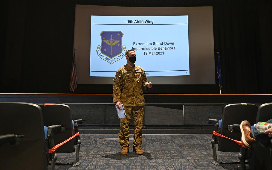 Lt. Col. Ryan Polcar, 19th Airlift Wing director of staff, discusses impermissible behaviors with members of the 19th Air Wing during the Extremism Stand-Down Day at Little Rock Air Force Base, Ark., on March 19, 2021.