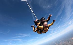 Ellen Comfort and U.S. Army Lt. Col. Ken Ates, Special Operations Command Para-Commando, skydive March 13, 2021, in Zephyrhills, Fla. Comfort is the Gold Star mother of Capt. Kyle Comfort, an Army Ranger who died during combat operations in Afghanistan in 2010. 

